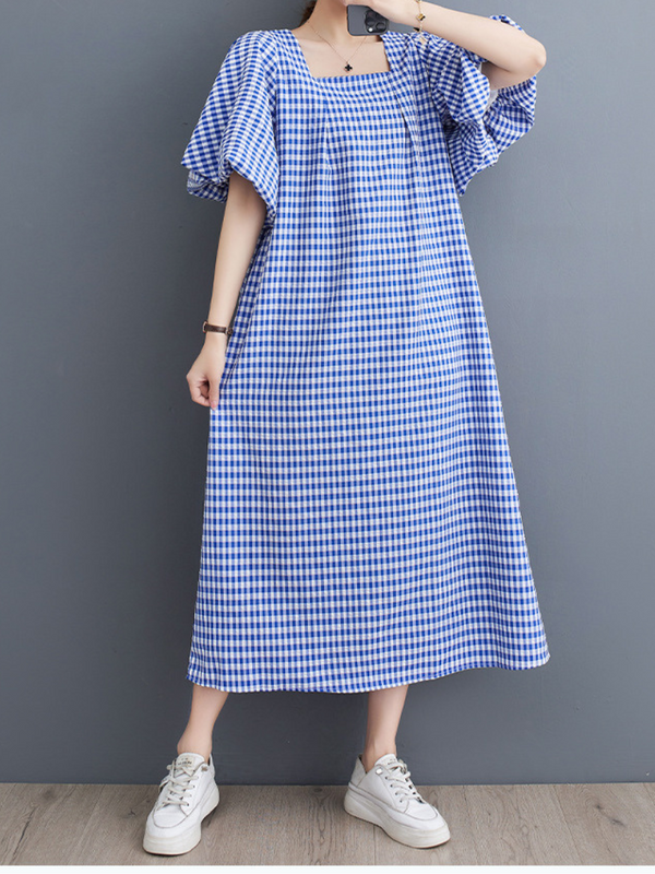 La délicieuse robe en ligne à carreaux carrés de femmes