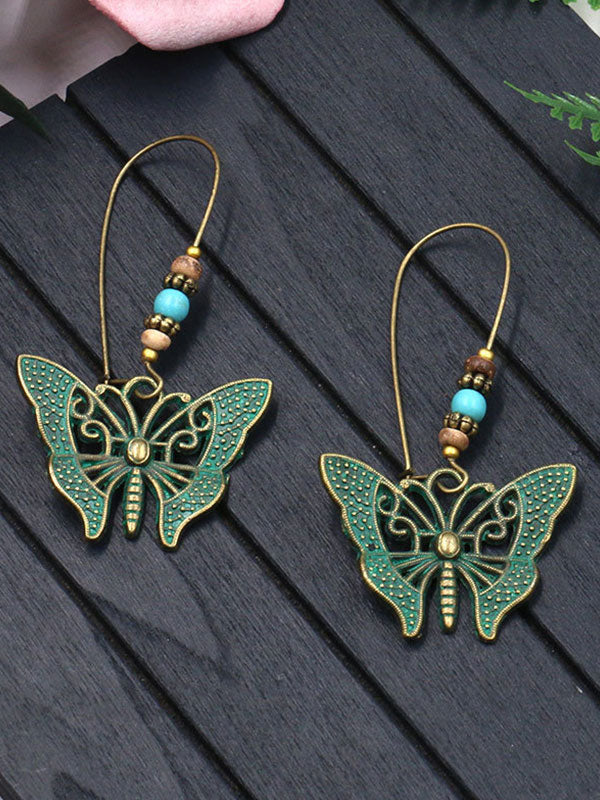 Chantent des boucles d'oreilles papillon des ailes