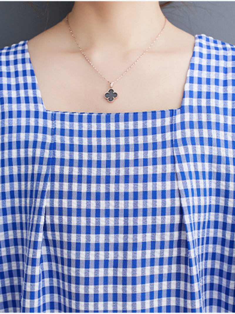 La délicieuse robe en ligne à carreaux carrés de femmes