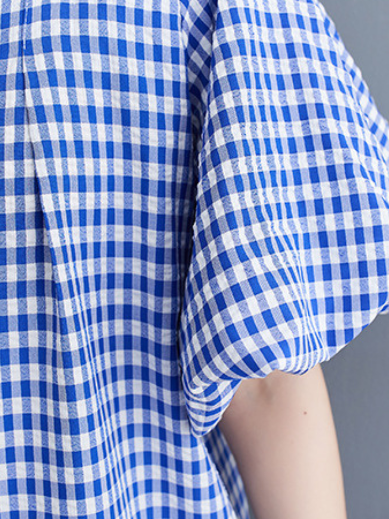 La délicieuse robe en ligne à carreaux carrés de femmes