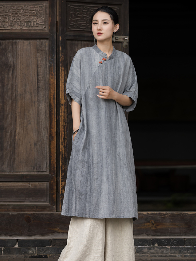 Women 's wearing a gray traditional outfit