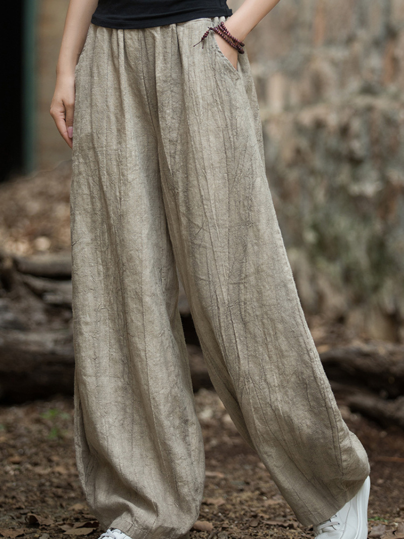 Women's  wearing beige wide-leg pants 
