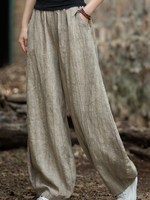Women's  wearing beige wide-leg pants 
