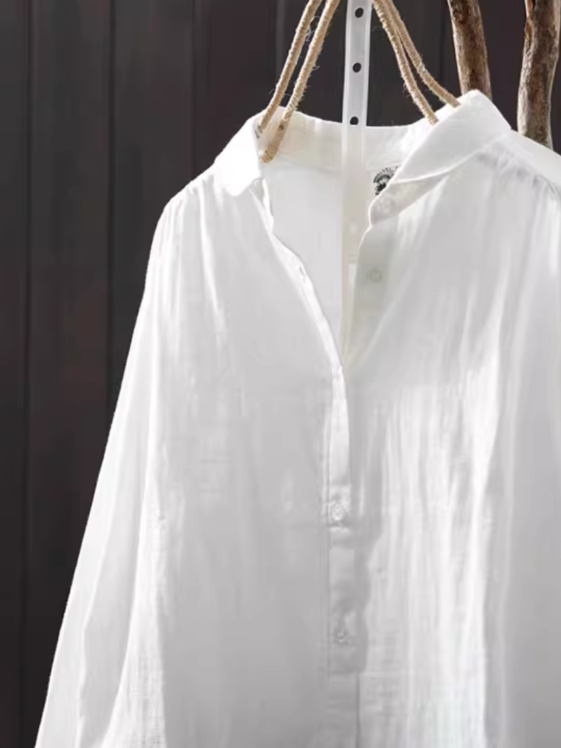 Minimalist cotton-linen button-down blouse with relaxed silhouette for elevated everyday style