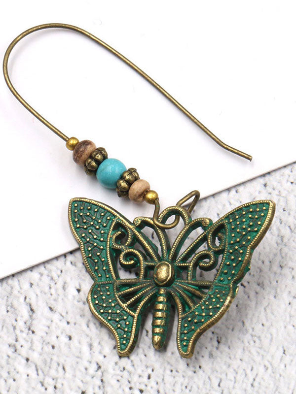 Chantent des boucles d'oreilles papillon des ailes