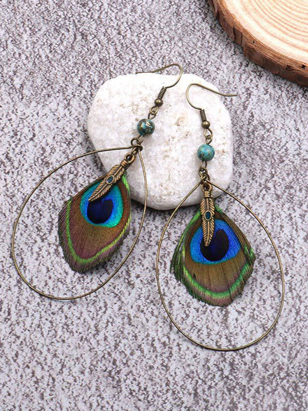 Belles boucles d'oreilles de plumage plumage