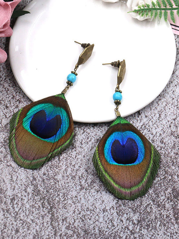 Boucles d'oreilles de plumes de paon d'addition immaculées