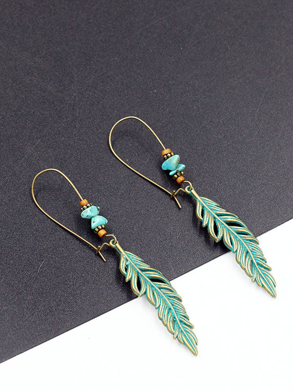 Chantent des boucles d'oreilles en plumes des ailes