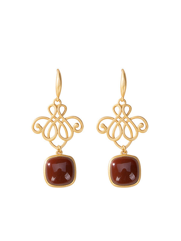 Des boucles d'oreilles en pierre de bijou